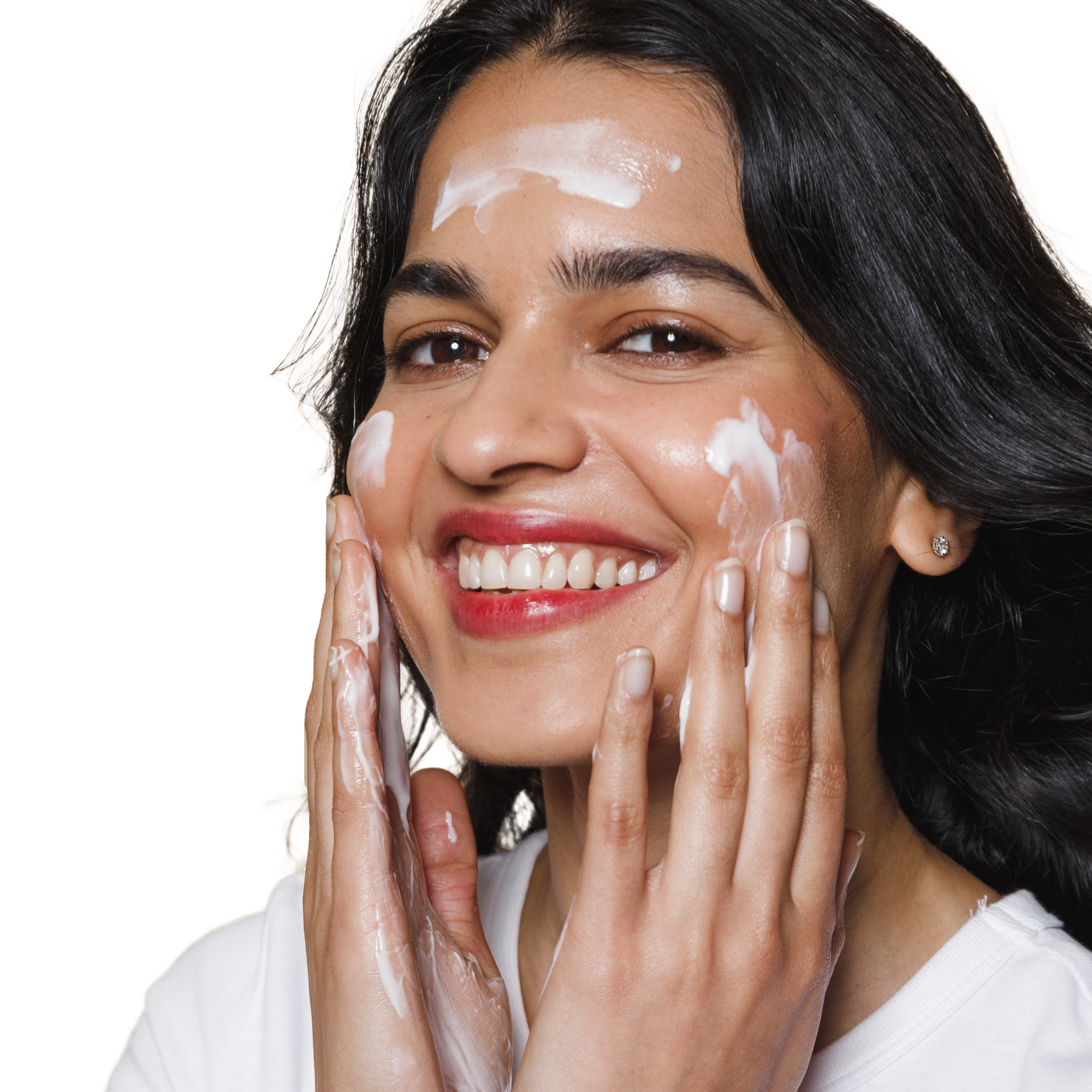 This is an image of a lady applying her Calming Cleanser onto her skin and rubbing it in. It is smooth and easy to apply and gently cleanses the skin. A cream cleanser that is hydrating and doesn't strip the skin and dry it out.