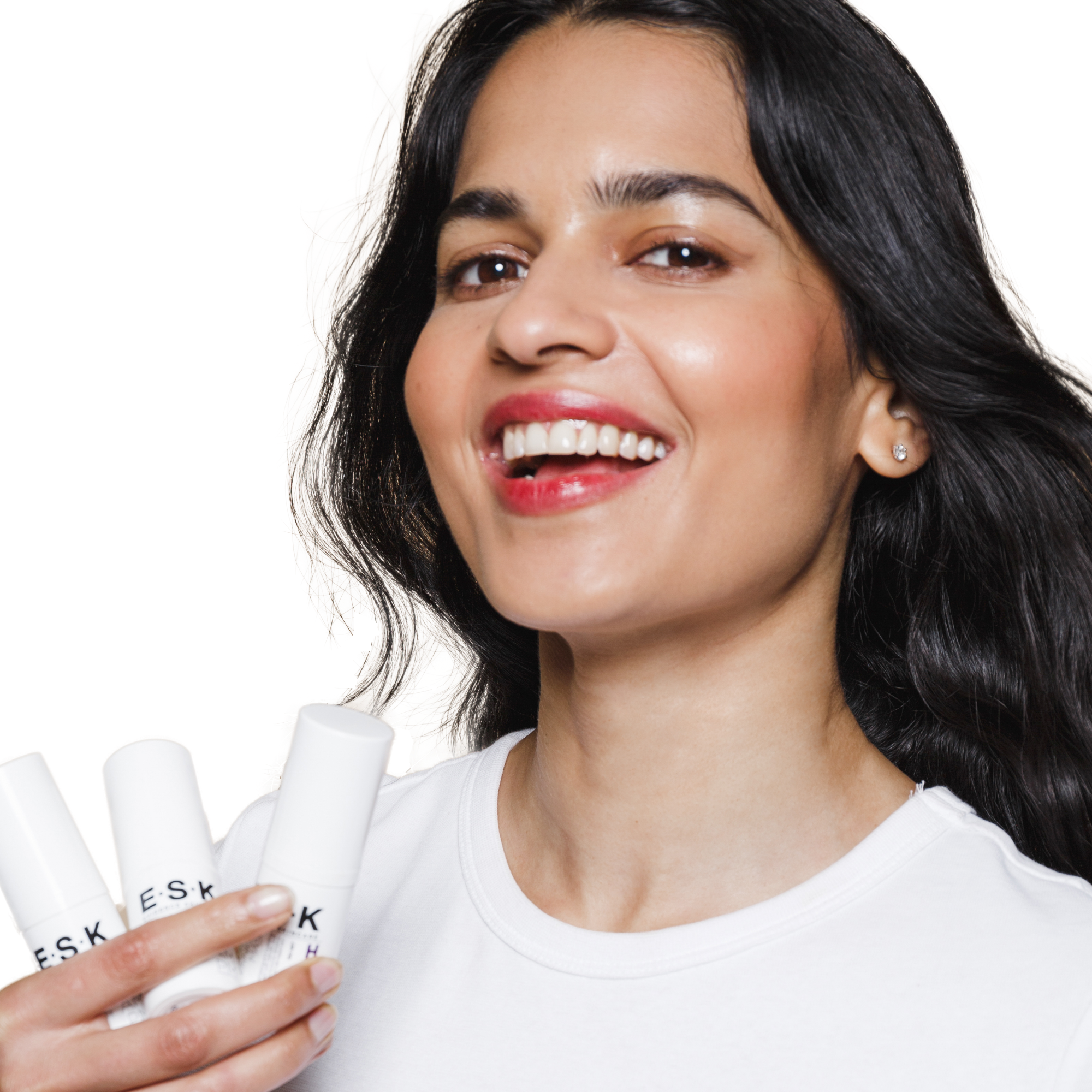 A woman holding her Hydroxy Overnight Mask. She uses the product overnight so that she can wake up with clear, glowy skin, That will work gentler than a peel.