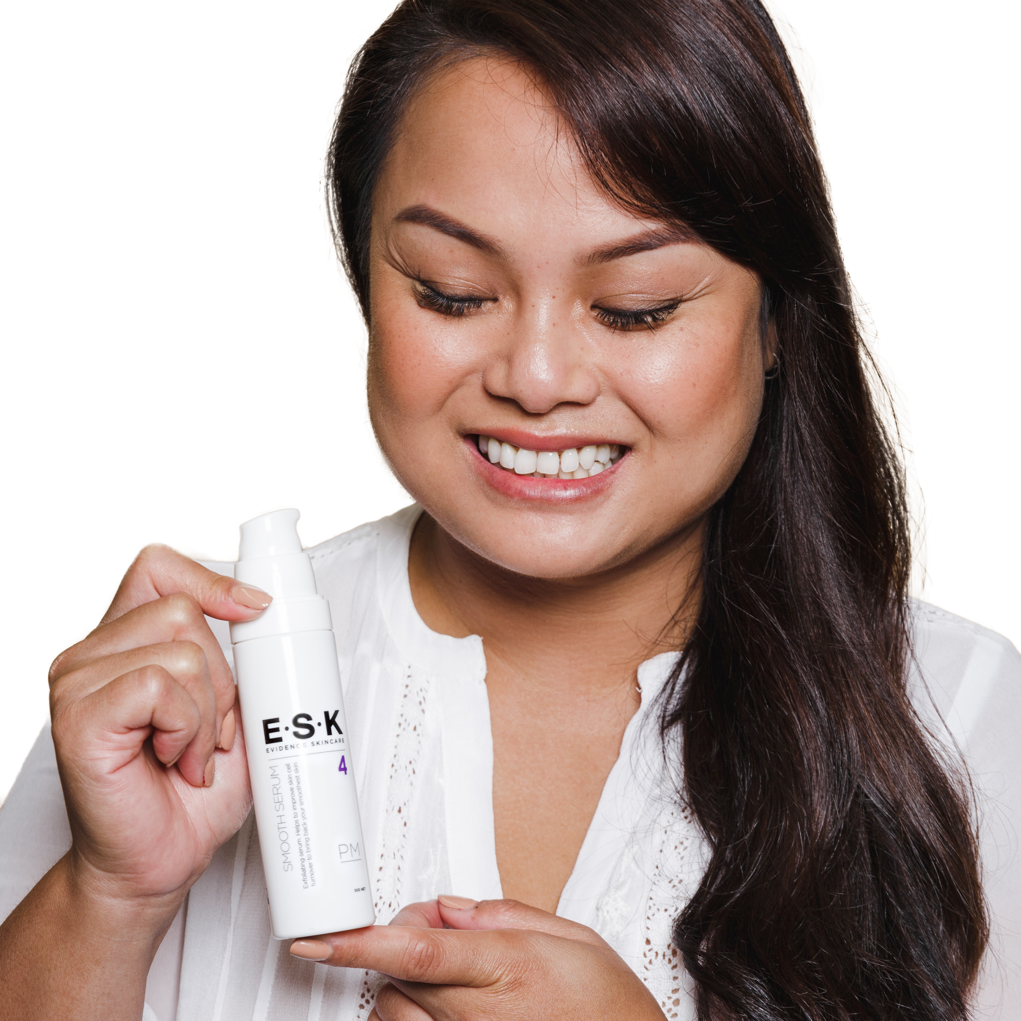 A lady holding her bottle of Smooth Serum! This exfoliating serum is great for targeting clogged pores, textured skin and uneven skin tone. The Lactic Acid and Glycolic acid gently and effectively exfoliate the dead skin and leaves your skin brighter, smoother and more even.