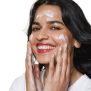 This is an image of a lady applying her Calming Cleanser onto her skin and rubbing it in. It is smooth and easy to apply and gently cleanses the skin. A cream cleanser that is hydrating and doesn't strip the skin and dry it out.