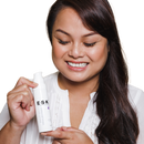 A lady holding her bottle of Smooth Serum! This exfoliating serum is great for targeting clogged pores, textured skin and uneven skin tone. The Lactic Acid and Glycolic acid gently and effectively exfoliate the dead skin and leaves your skin brighter, smoother and more even.